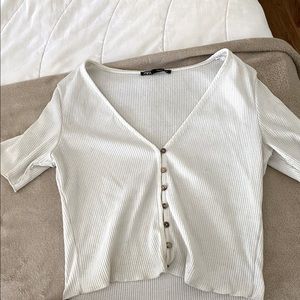 White button down Zara tee shirt.